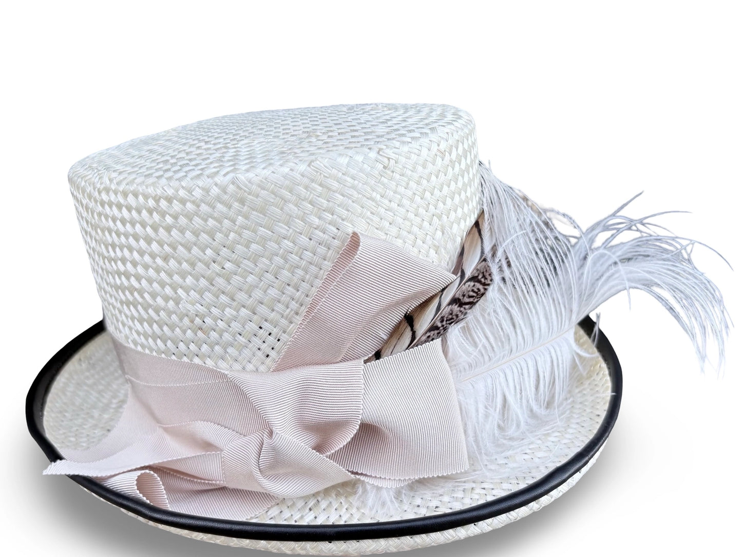 White straw hat with a Ivory bow and feather on a white background