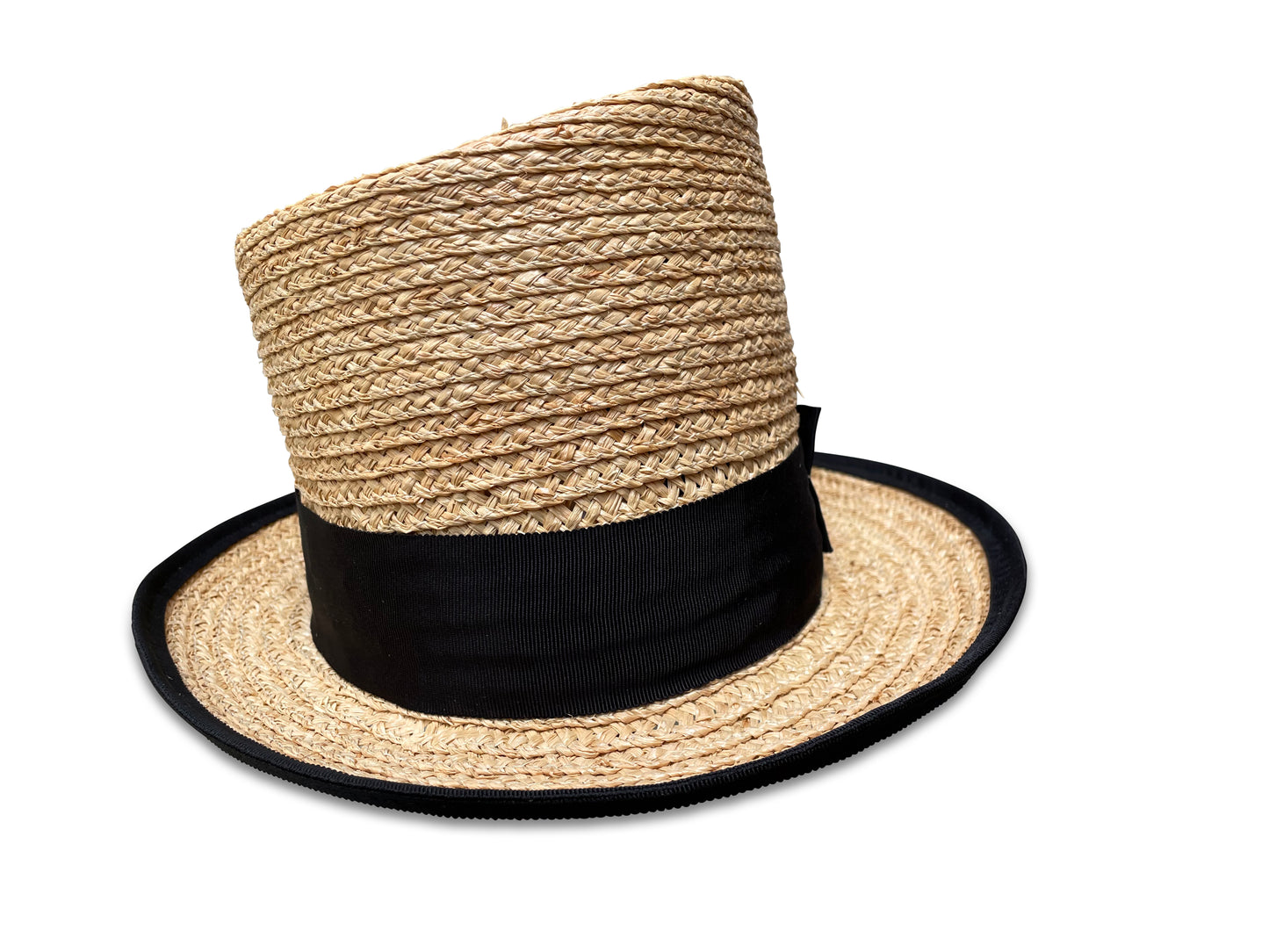 Raffia braid top hat with asymmetrical crown. Hat is trimmed with black grosgrain ribbon. The brim is piped with black grosgrain ribbon.
