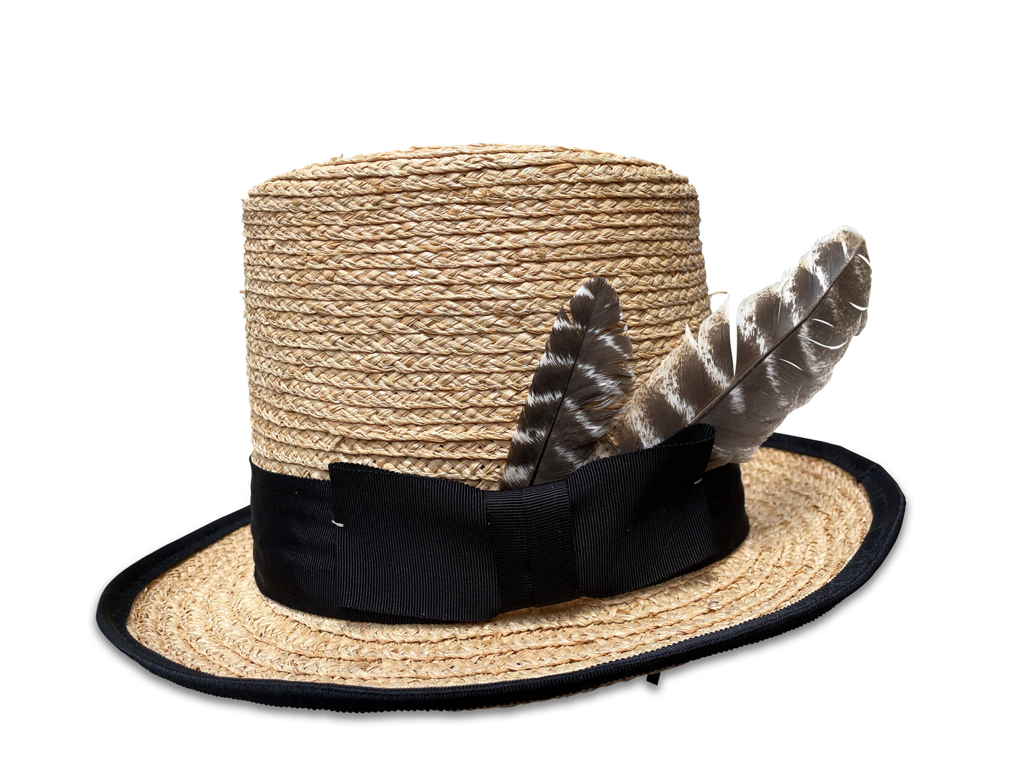 Raffia Braid Top Hat with black ribbon trim.The brim is piped with black ribbon. Hat features two turkey feathers at the bow on the trim.