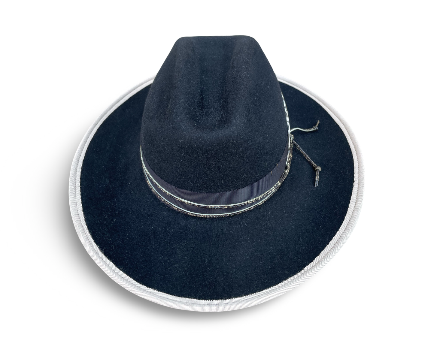 Black Fur Felt Cowboy hat, Open Road Crown with Grosgrain trim. Finished with distressed cord and feather. Brim is piped with Ivory Grosgrain.