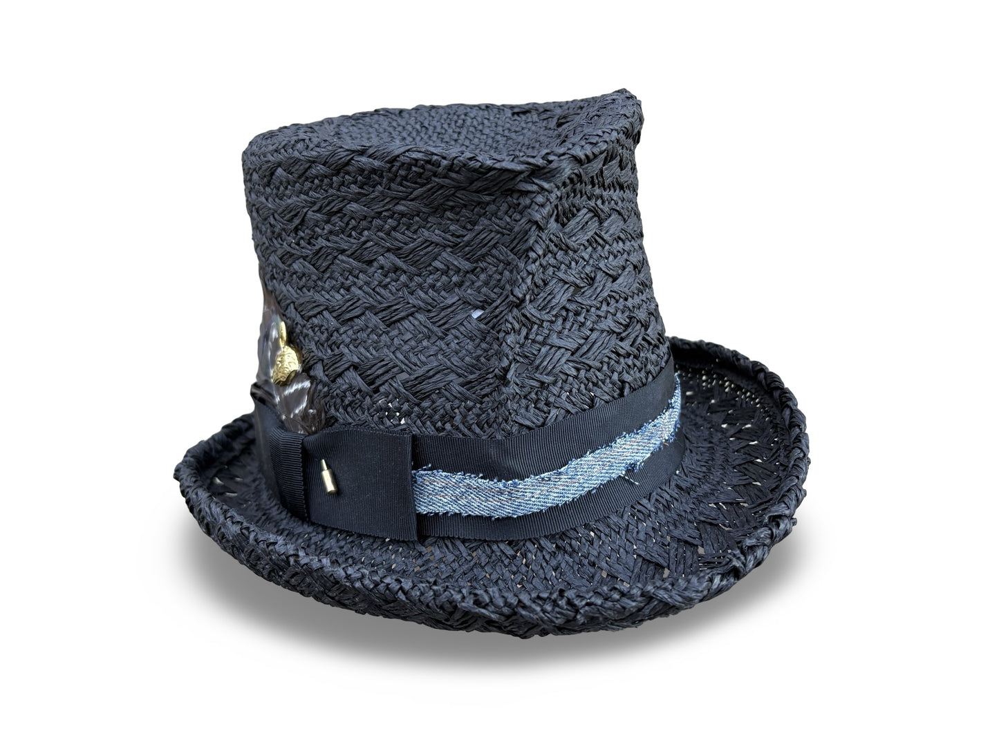 Black straw top hat with decorative band on a white background