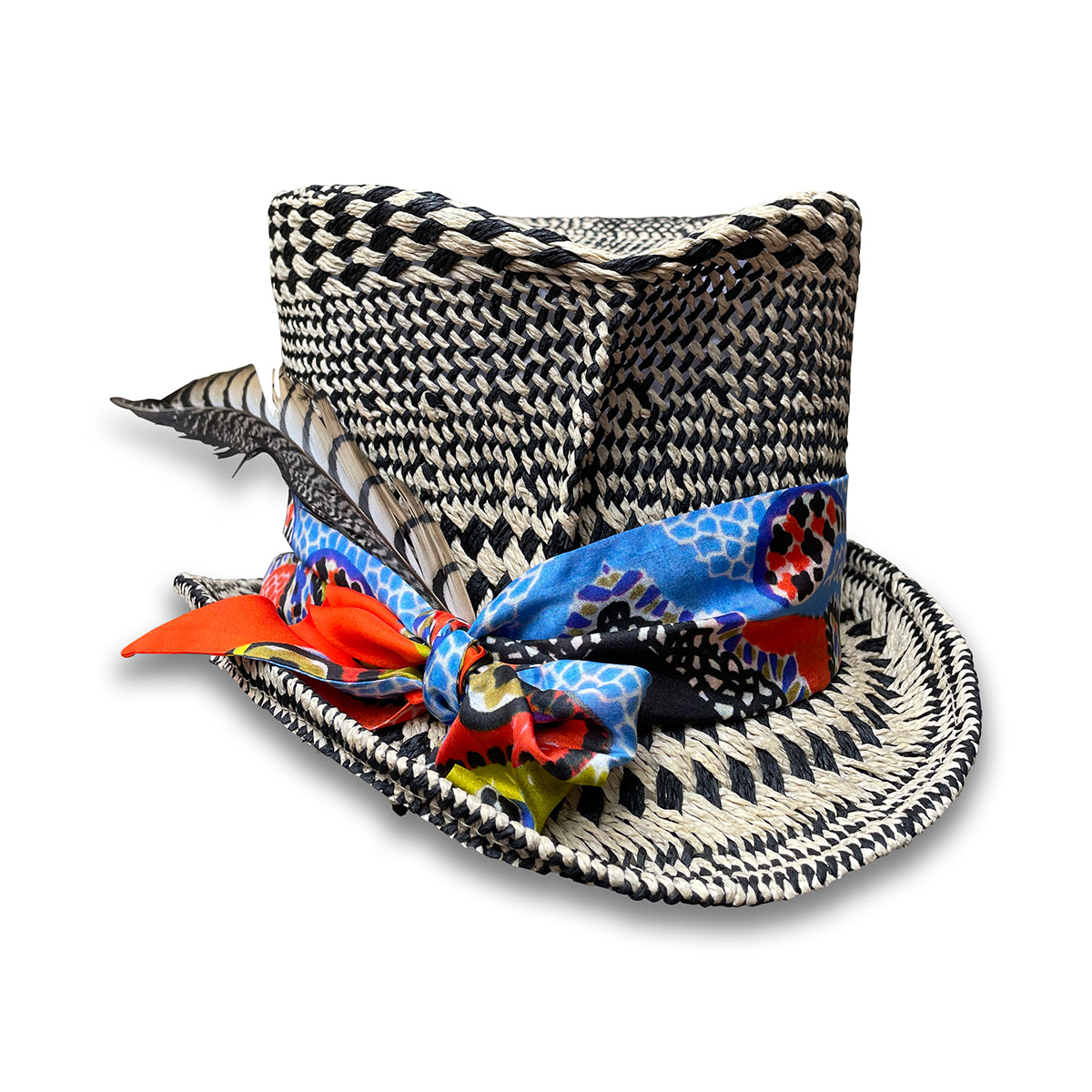 Black and Ivory graphic pattern straw top hat with silk scarf trim and pheasant tail feather.