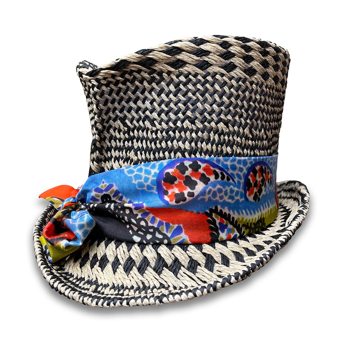 Black and Ivory graphic pattern straw top hat with silk scarf trim and pheasant tail feather.