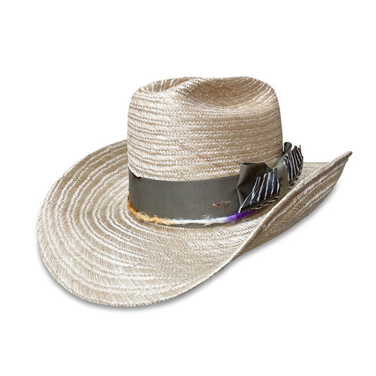 a Chatte cowboy hat made from lightweight, breathable sisol straw, trimmed with a worn grosgrain ribbon and vibrant silk yarn, finished with a natural turkey feather - made at Cha Cha's House of Ill Repute in New York City