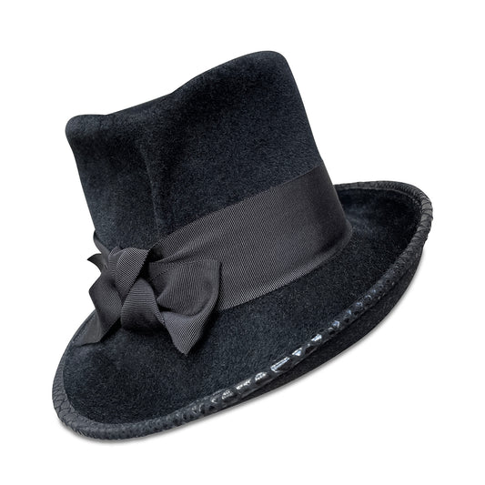A black "Topedora" hat that combines elements of a top hat and a fedora. It has a hand-pleated top hat crown and an asymmetrical fedora brim. The brim features black faux lizard piping, and the hat is adorned with a wide grosgrain ribbon. The image shows the hat isolated on a white background, highlighting its unique design and elegant details.