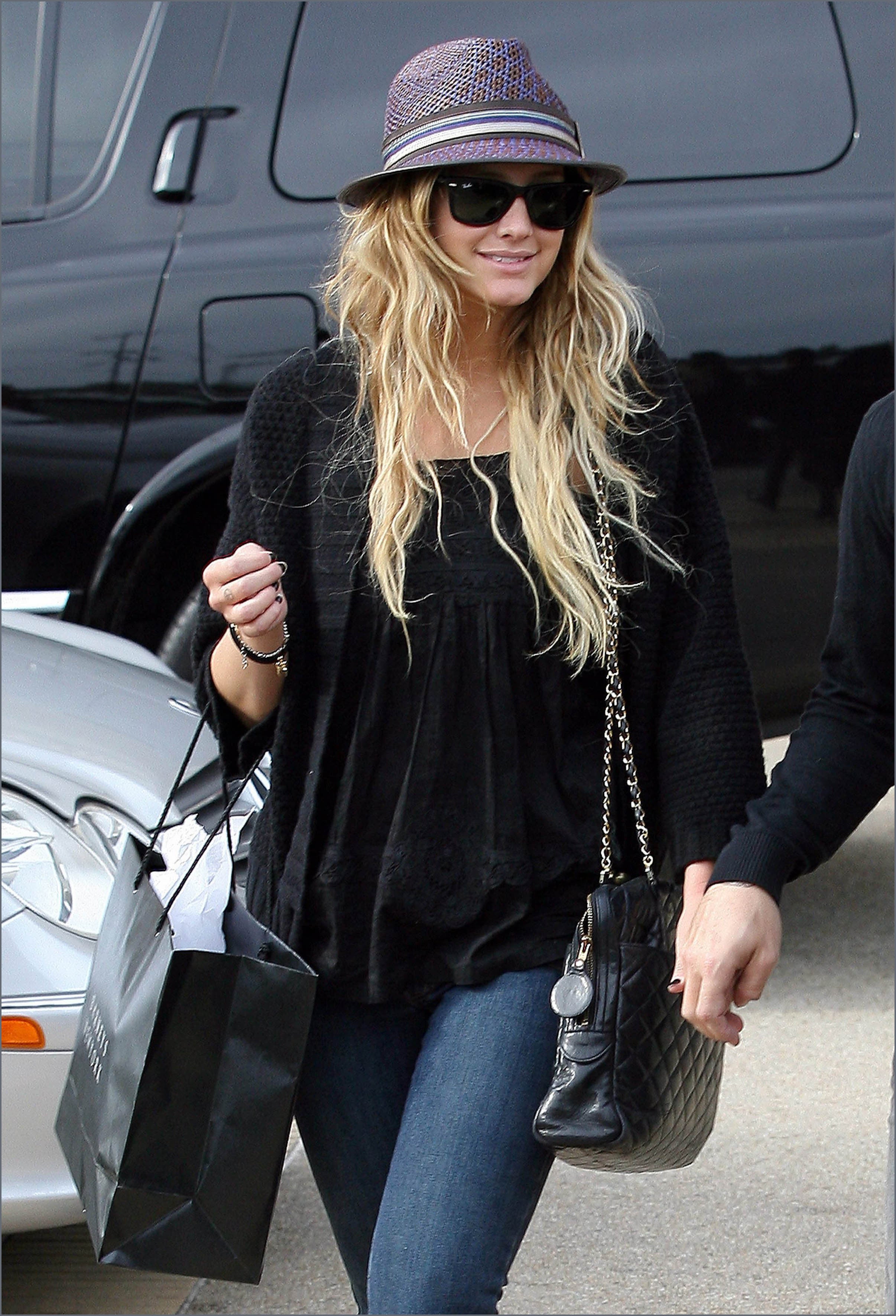 Ashlee Simpson wears a straw fedora from Cha Cha's House of Ill Repute, a hat shop in NYC