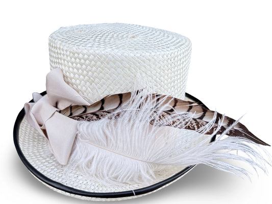 White woven hat with feather accents on a white background front view