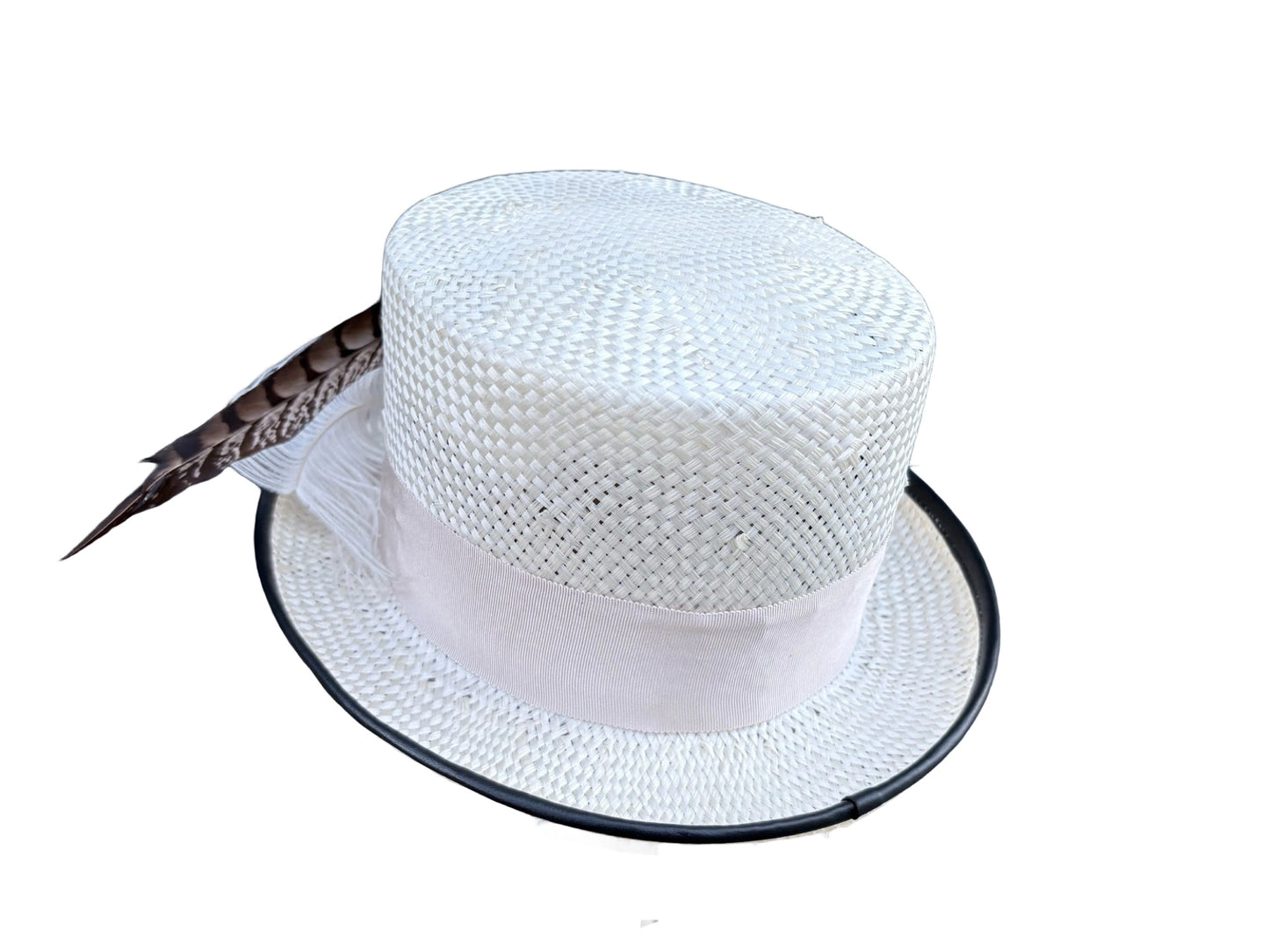 White straw hat with a feather on a white background