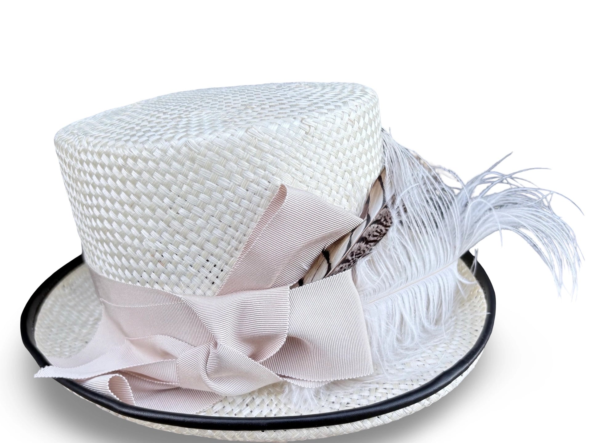 White straw hat with a Ivory bow and feather on a white background