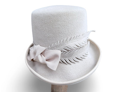 Alabaster Cloche Bucket Hybrid hat with matching piping and Grosgrain trim. Hand made felt feathers.
