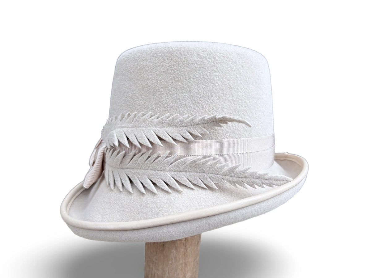 Alabaster Cloche Bucket Hybrid hat with matching piping and Grosgrain trim. Hand made felt feathers.
