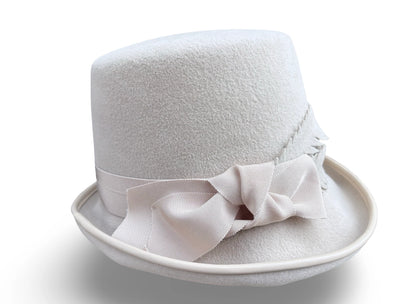 Alabaster Cloche Bucket Hybrid hat with matching piping and Grosgrain trim. Hand made felt feathers.
