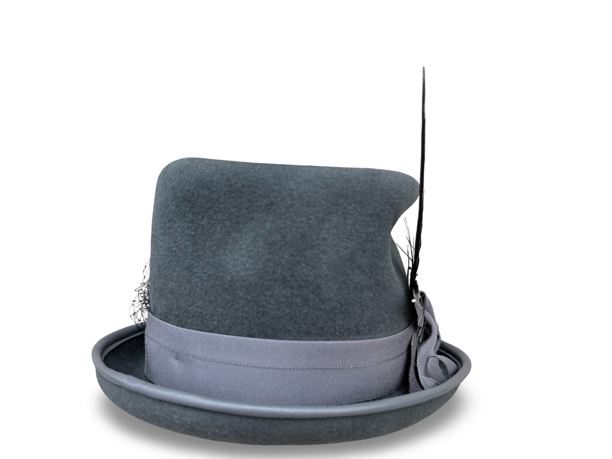 A dark gray felt top hat with a matching gray band, a decorative gray bow on the side, and a long matching feather accent, shown against a plain white background.
