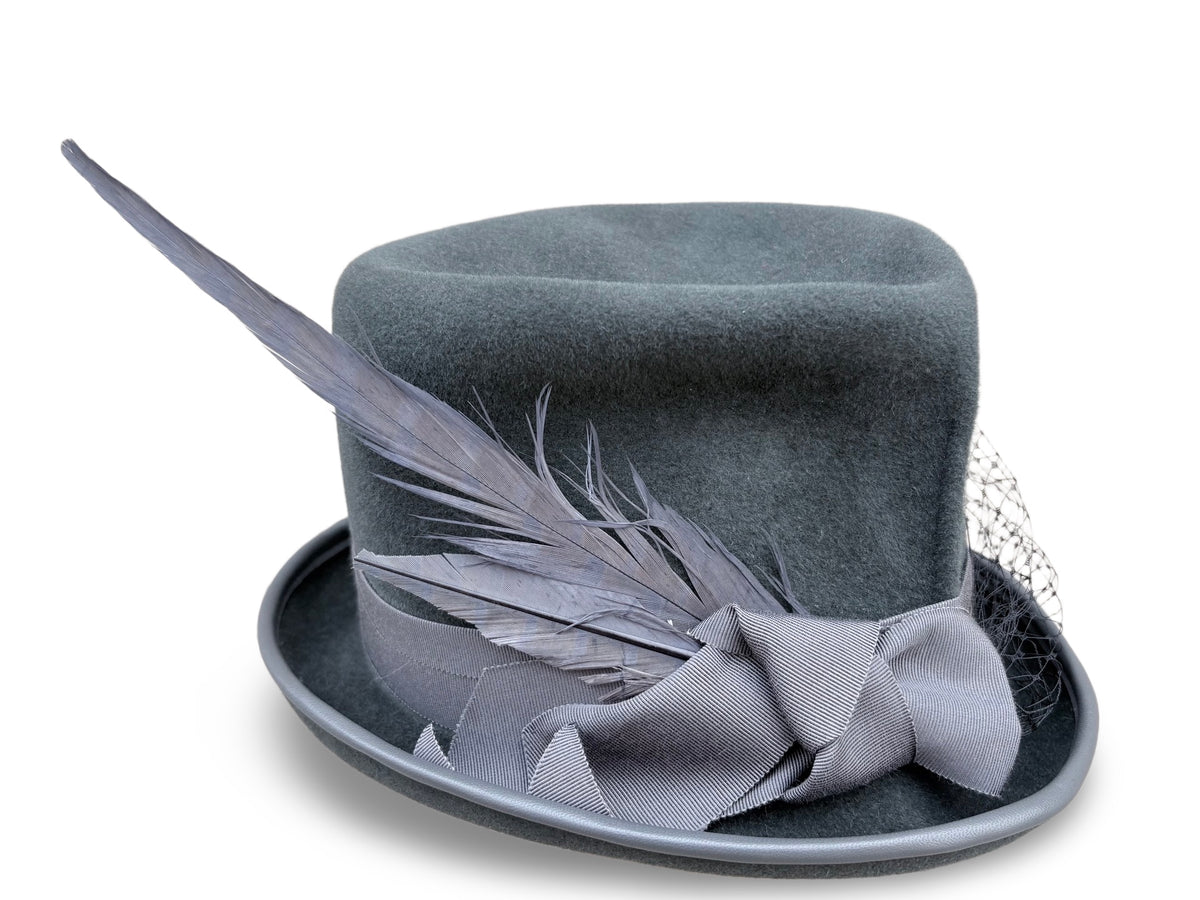A dark gray felt top hat with a matching gray bow and feather accent, set against a plain white background.