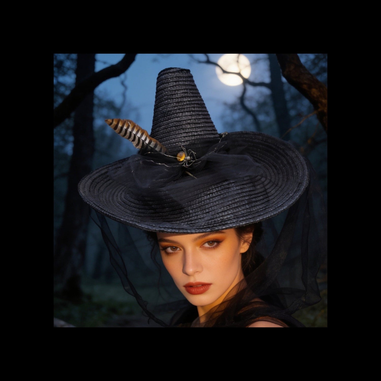 A woman wearing a large black witch-style hat with a feather and spider decoration, photographed outdoors in a dark forest at night under a full moon.