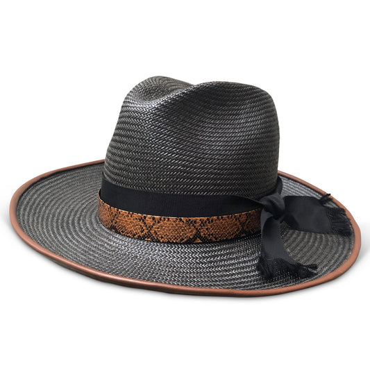 Black straw fedora with chocolate leather piping. Black ribbon trim overlaid with lizard layer. Center dent crown with three inch brim. 