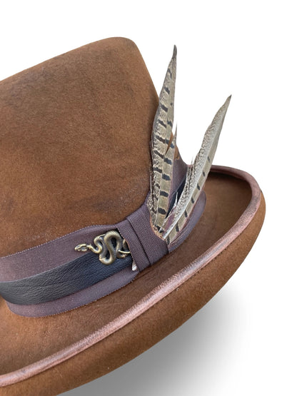 Trim detail - snake charm, distressed grosgrain and pheasant feathers