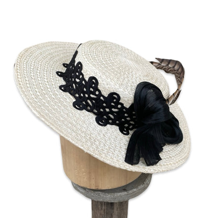 Low Crown Boater with black passmentrie trim and blacksilk abaca bow with pheasant tail. 