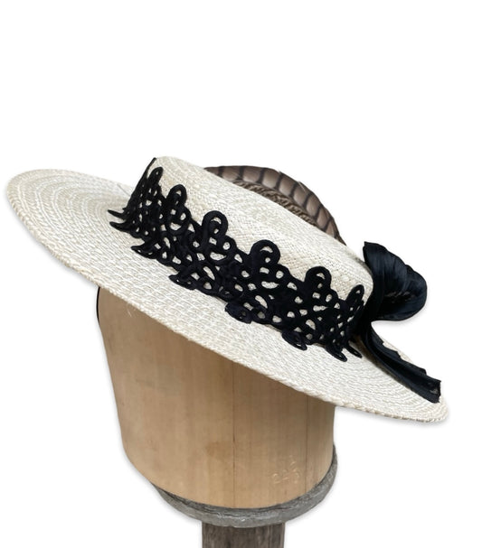 Low Crown Boater with black passmentrie trim and blacksilk abaca bow with pheasant tail. 