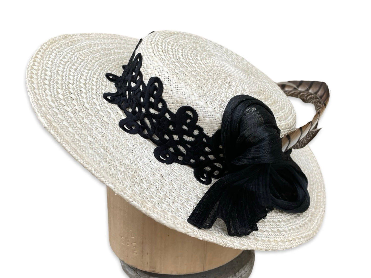 Low Crown Boater with black passmentrie trim and blacksilk abaca bow with pheasant tail. 