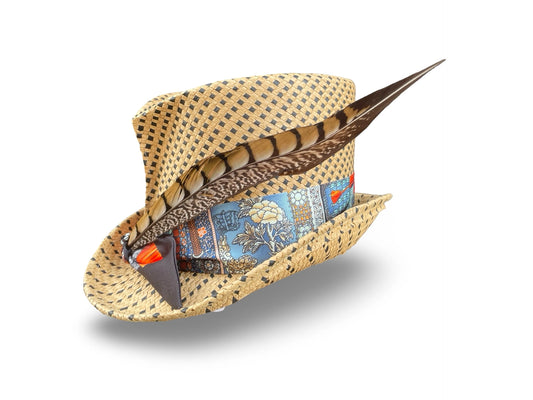 Polka Dot Straw hat with decorative feather and colorful band on a white background