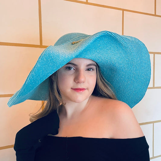 Wide Brim Straw Swinger Hat. Turquoise Straw. PInned up in front with a gold kilt pin