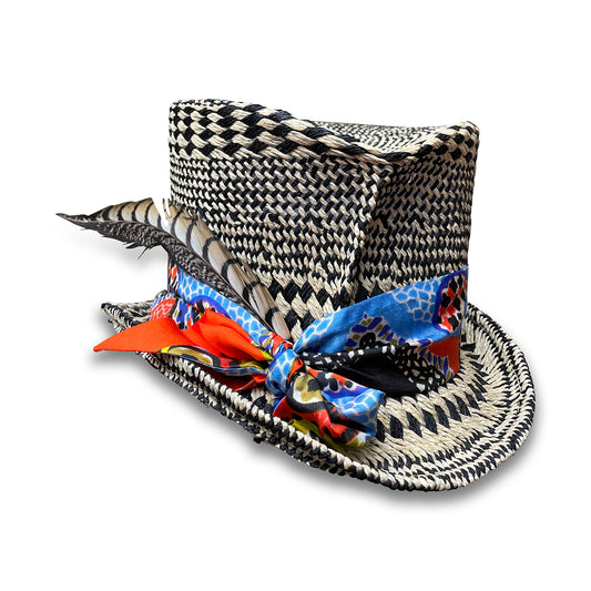 Black and Ivory graphic pattern straw top hat with  silk scarf trim and pheasant tail feather. 