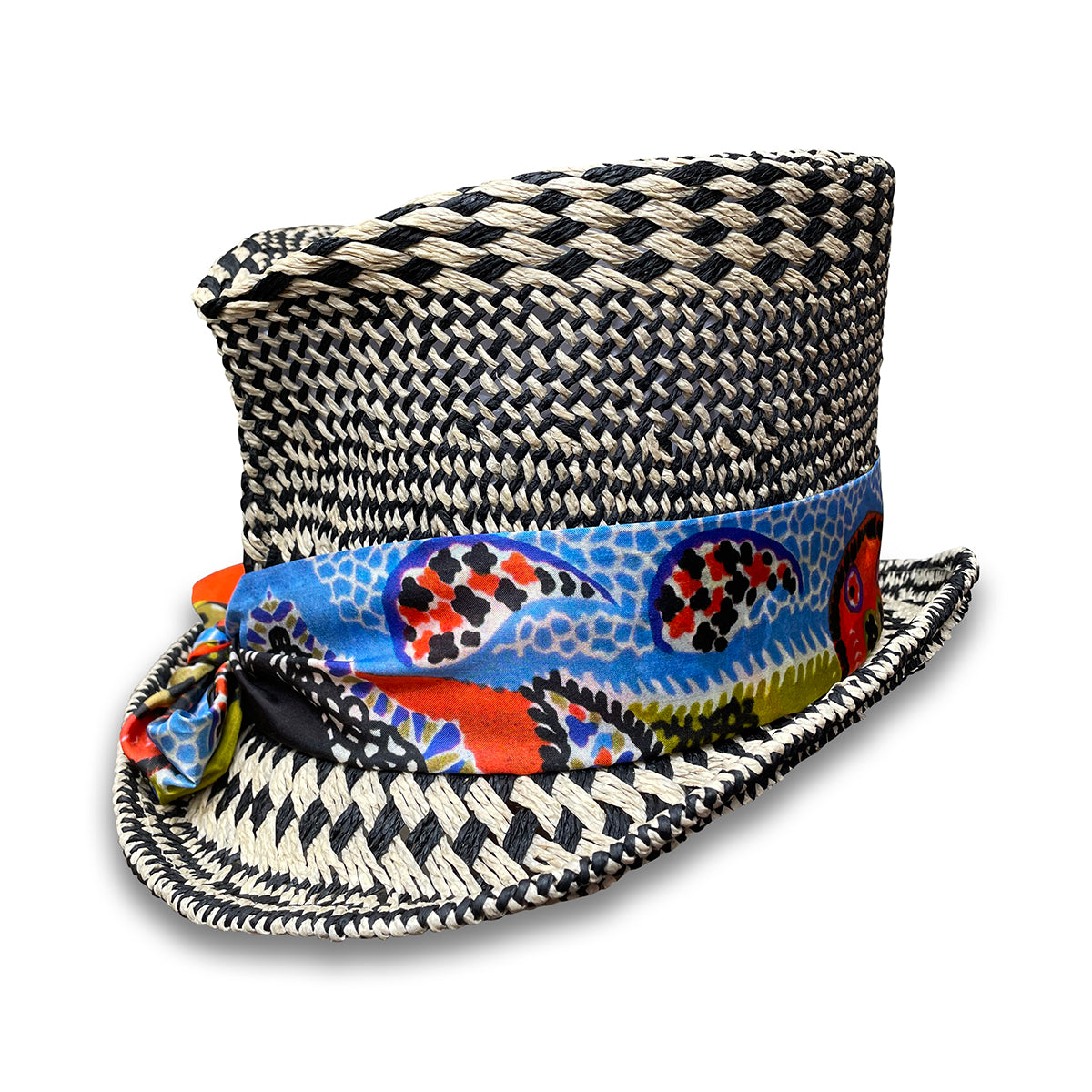 Black and Ivory graphic pattern straw top hat with silk scarf trim and pheasant tail feather.