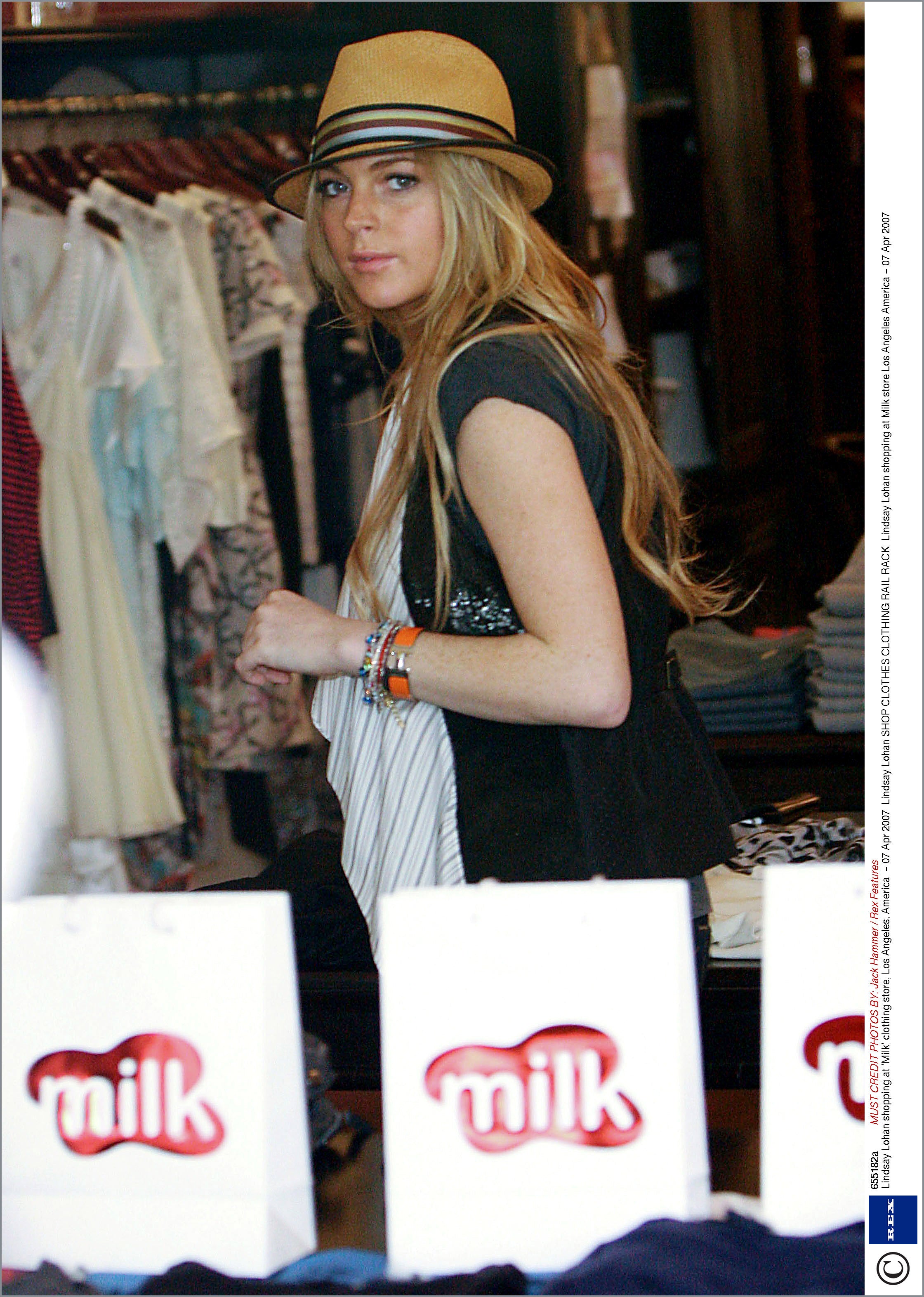 Lindsay Lohan wearing a straw fedora from Cha Cha's House of Ill Repute, a hat shop in NYC