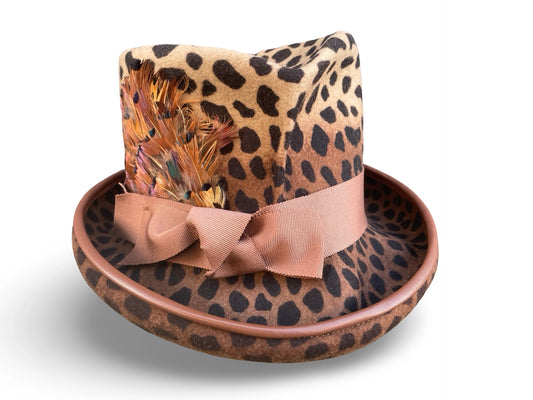 Leopard print hat with a bow on a white background