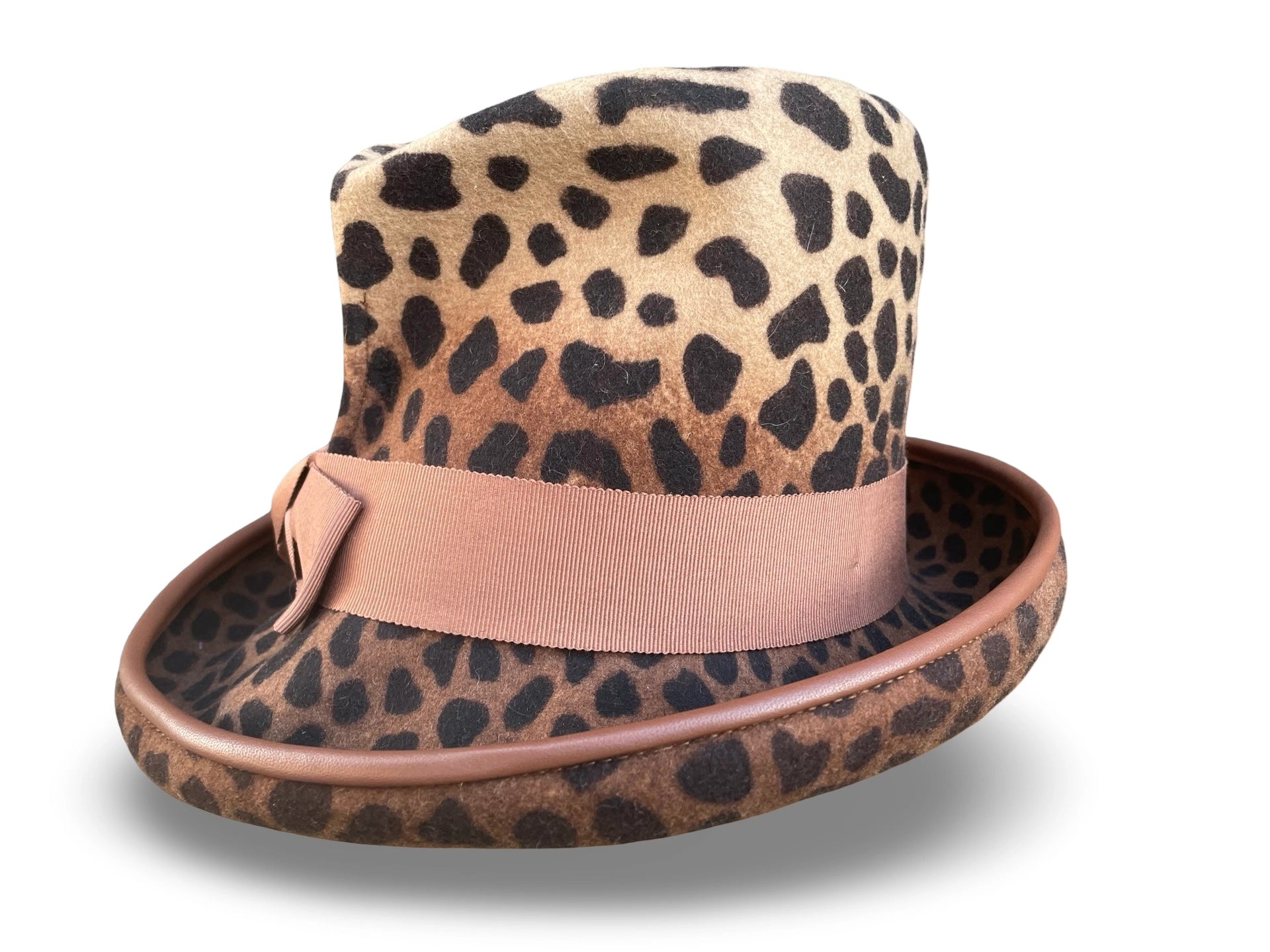 Leopard print hat with a matching band on a white background