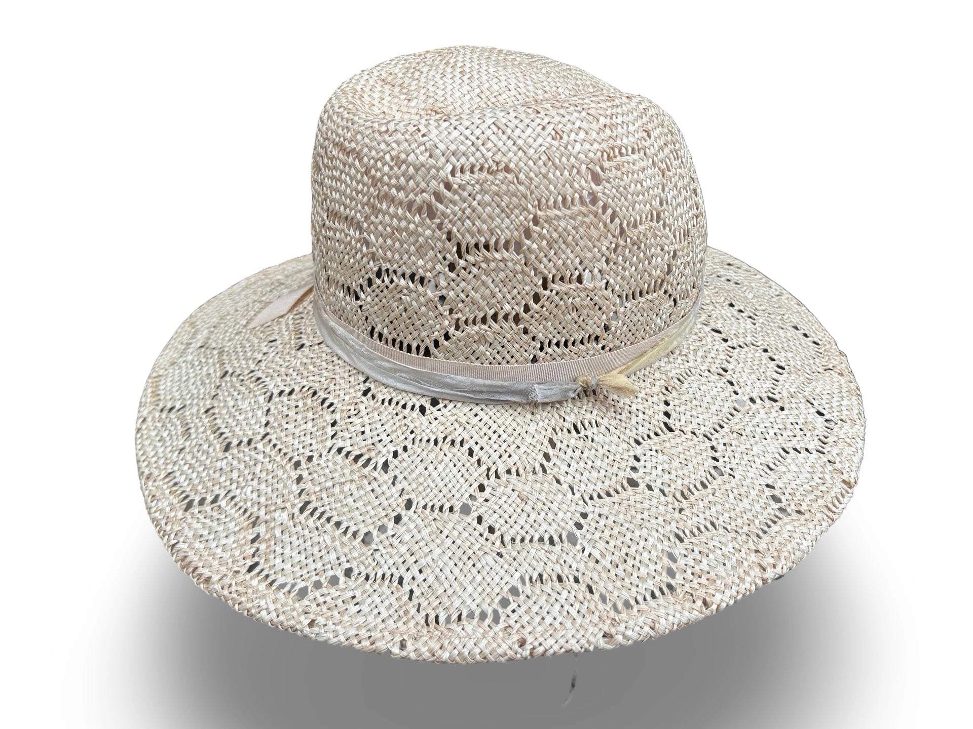 Beige woven sun hat with a wide brim on a white background