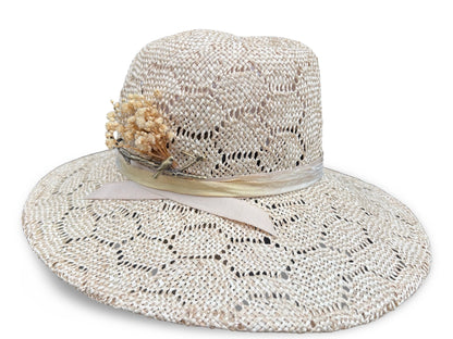 Beige straw hat with a decorative flower on a white background