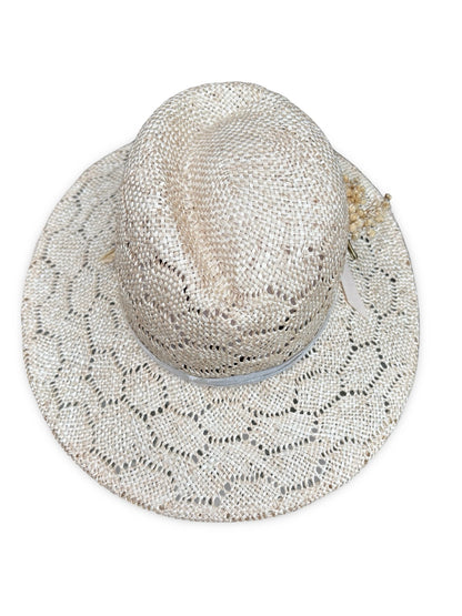 Top of Crown view of woven straw hat with a wide brim on a white background