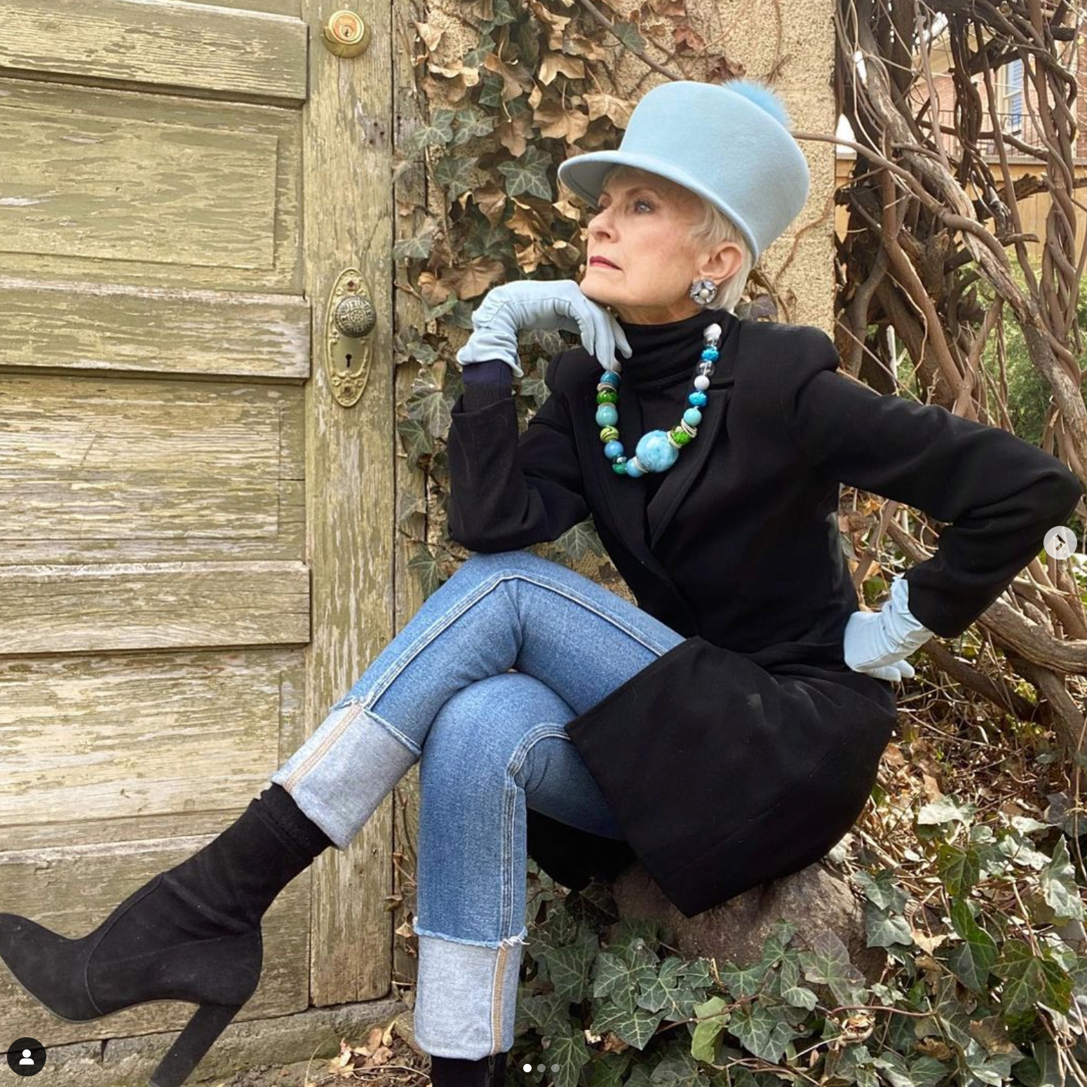 Judith Boyd wearing a custom blue top hat from Cha Cha's House of Ill Repute, a new york millinery