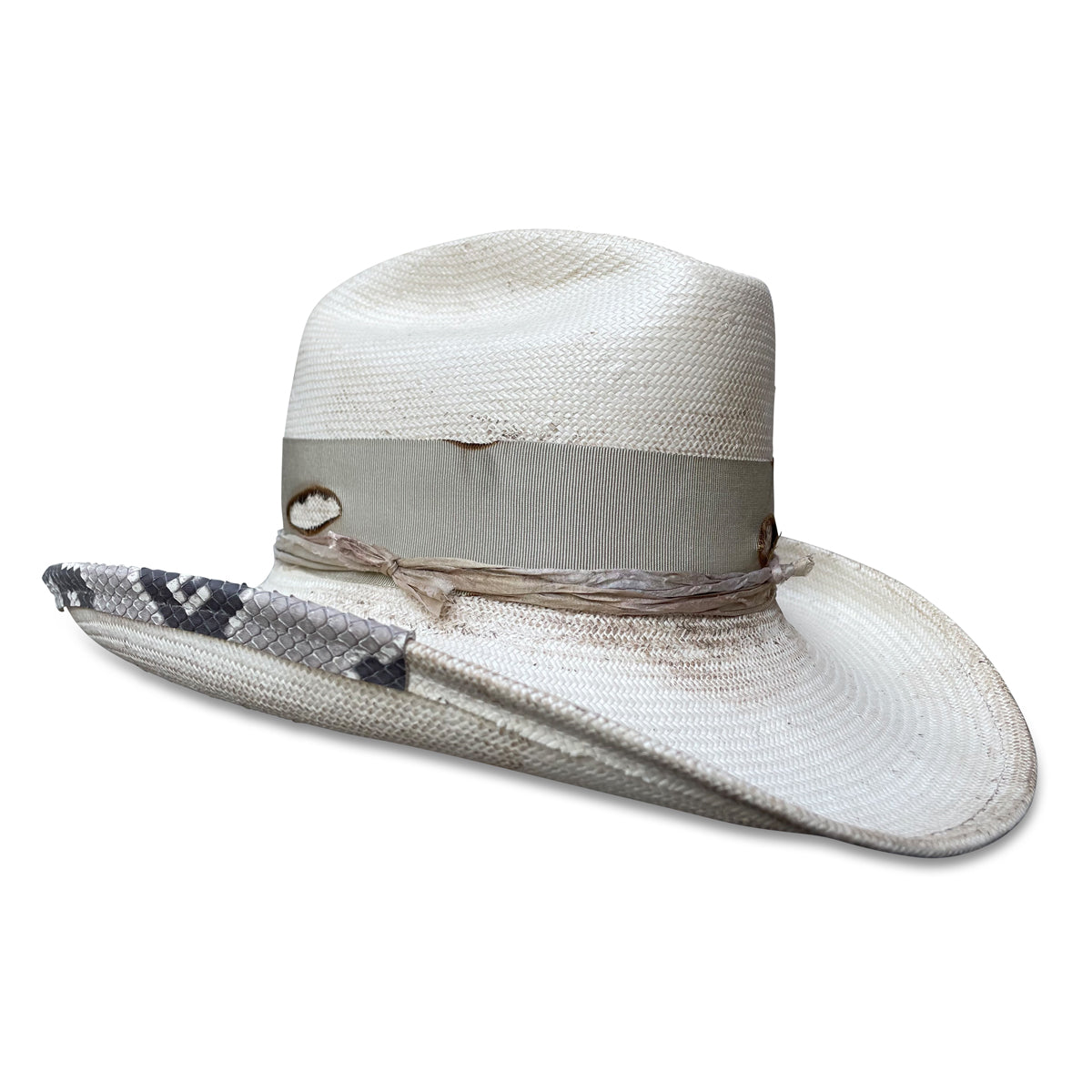 La Petite Chatte cowboy hat featuring sun-protective straw, a weathered look, and unique snakeskin detailing