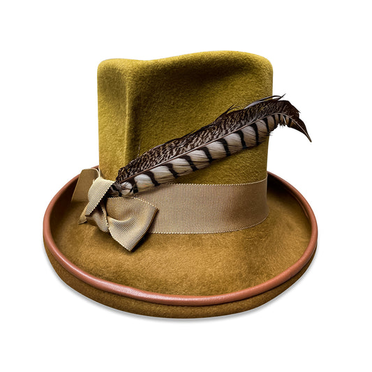 El Diablo - an antique gold top hat with a slouchy, pleated crown and a pheasant tail feather wrap. The hat features a grosgrain ribbon band and is finished with a lambskin-trimmed brim. A satin liner completes the interior for added elegance and comfort. From Cha Cha's House of Ill Repute, a woman-owned millinery in New York City.