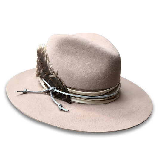 Biege Wool Western Style Fedora with silk trim and suede cord. Three inch brim, right side view. with a turkey feather