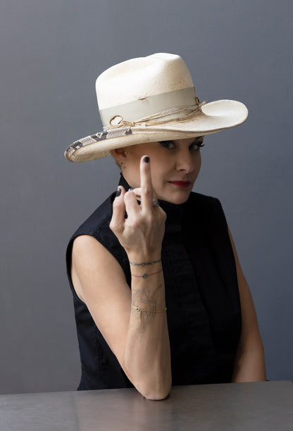Handcrafted, distressed ivory Shantung straw cowboy hat with a touch of snakeskin and a feather, from Cha Cha's House of Ill Repute, a NYC millinery.