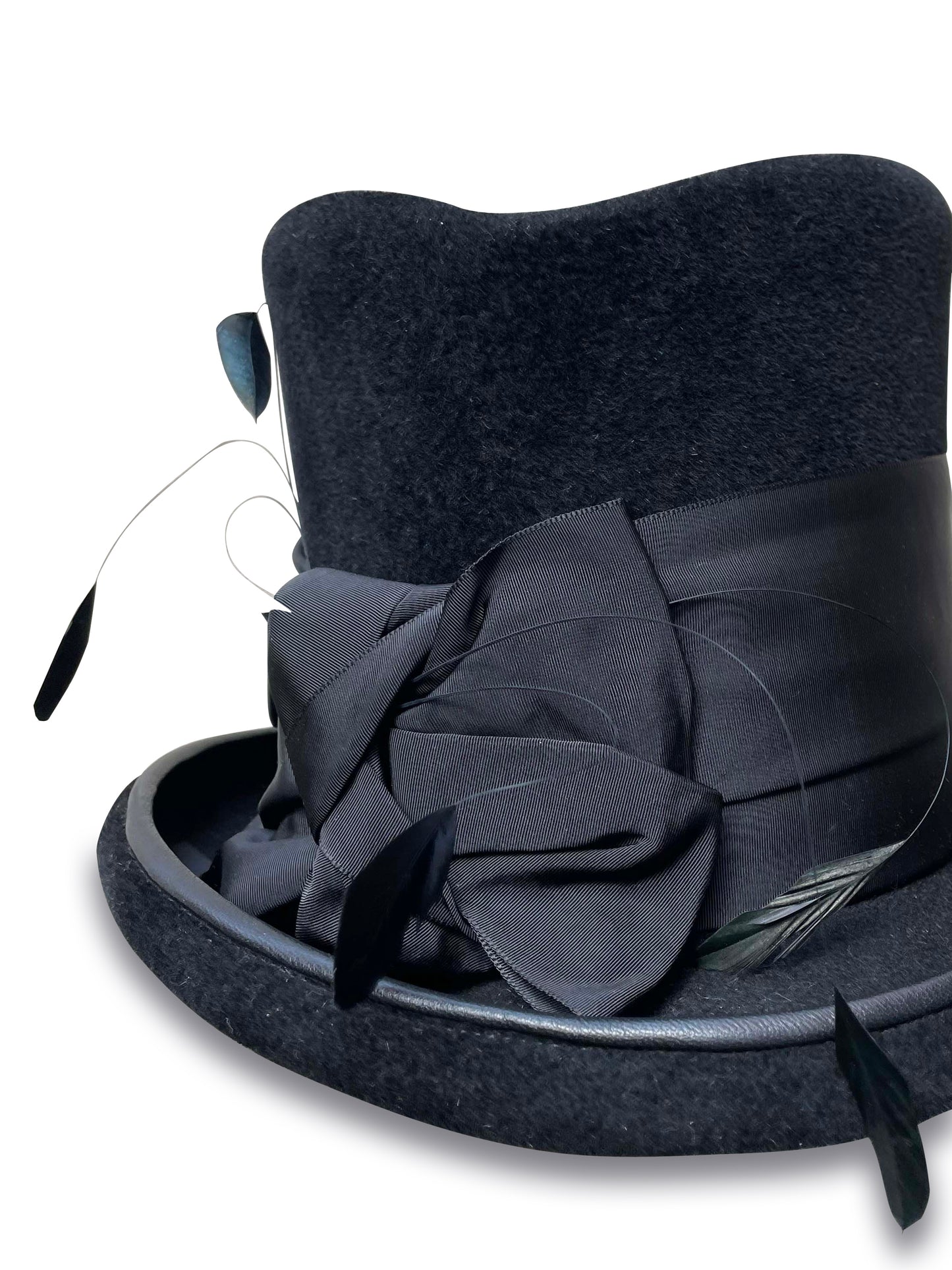 wide black ribbon wraps around the base of this unique top hat