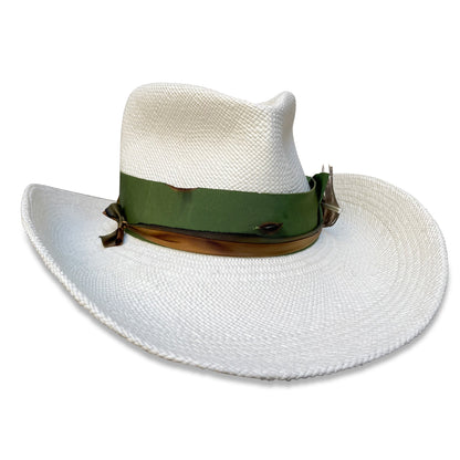 A white, made-to-order Superpinch Cowboy hat with a fedora crown, green ribbon, and turkey feather accent