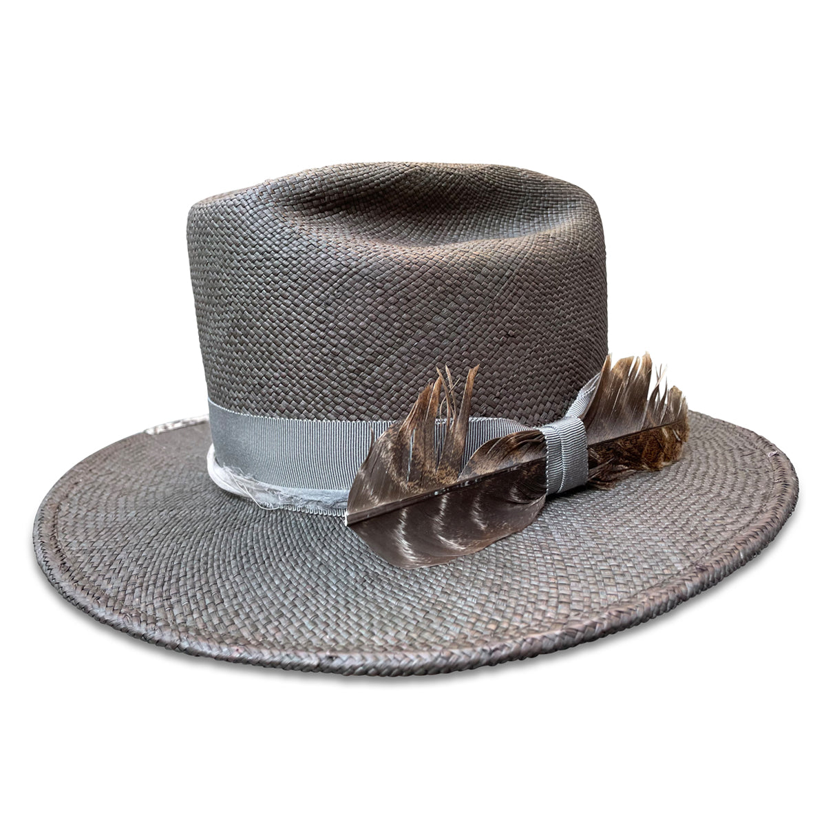 Elegant straw cowboy hat by Cha Cha's, combining traditional and modern elements with a rock and roll edge.