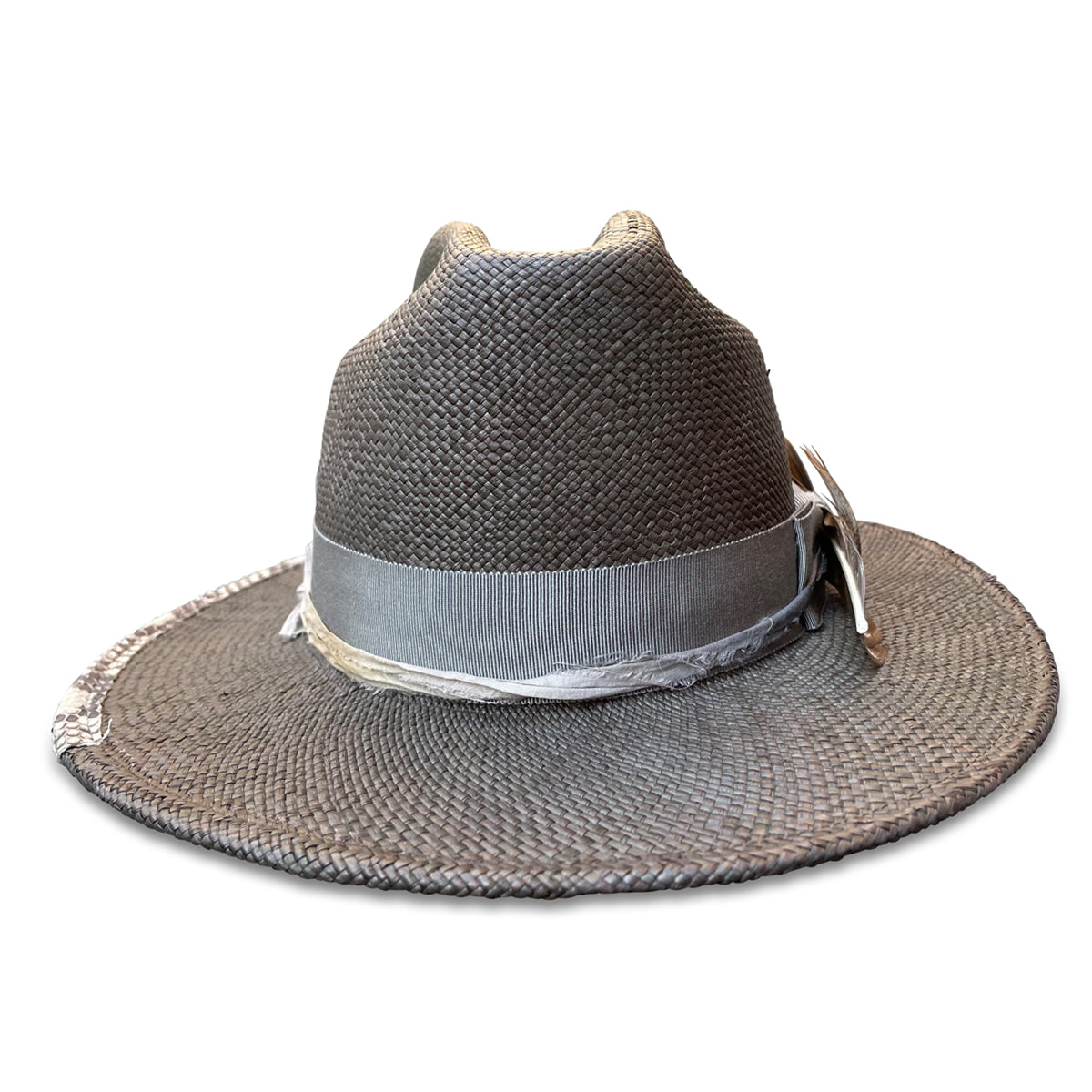 Straw cowboy hat with an open road style crown, grosgrain ribbon, sari silk, and a snake skin patch on the brim